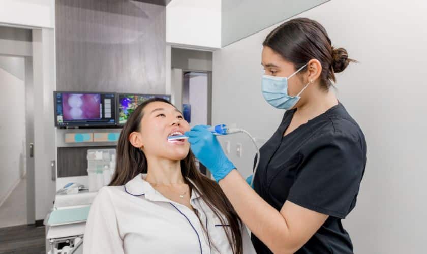 Signs you may need an oral exam in Brampton, including bleeding gums and tooth sensitivity
