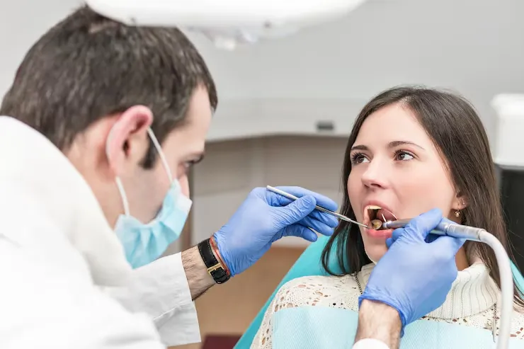 Signs of gum recession including exposed tooth roots and uneven gumline