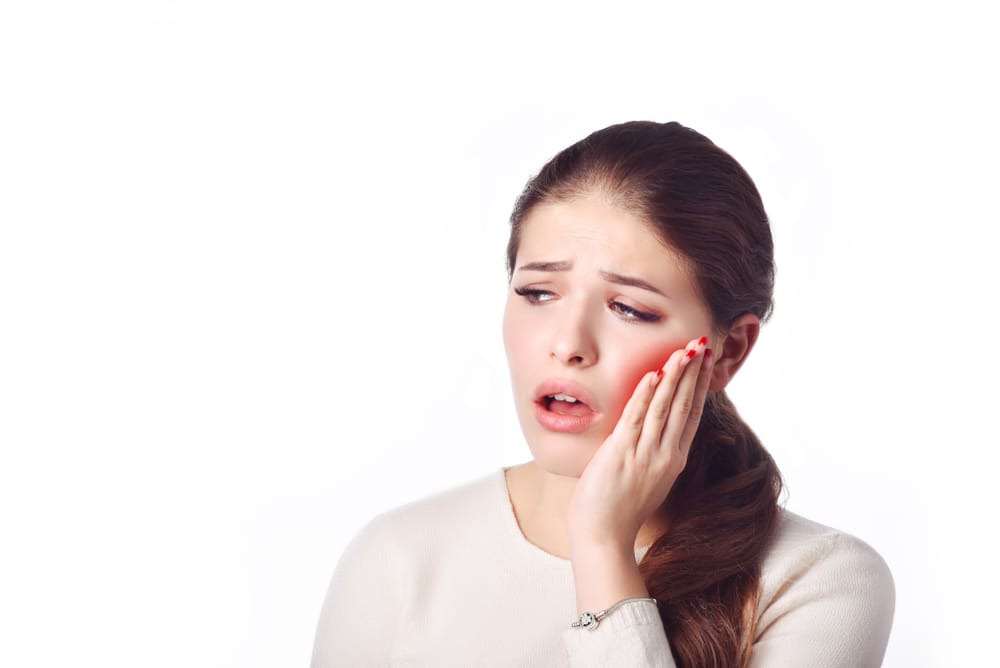 Signs you need a root canal in Brampton including tooth pain, sensitivity, swelling, and infection